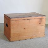 A Victorian stripped pine trunk, with a mahogany lid,