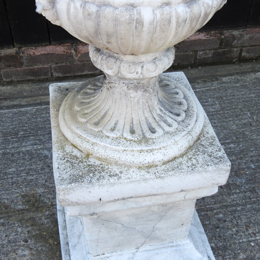 A weathered reconstituted stone faux marble garden urn, on a pedestal base, - Image 3 of 13