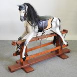 A Haddon painted wooden dappled grey rocking horse,