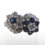 An 18 carat gold sapphire and diamond cluster ring, of double crossover flower head design,