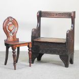 An early 20th century oak settle, 70cm,