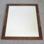 A gilt and wooden framed wall mirror,