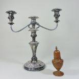 A 19th century turned treen muffineer, 15cm high, together with a plated candelabra,