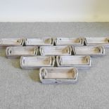 A set of ten wooden trays, 34cm,