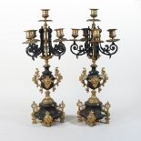 A pair of ornate gilt metal four branch candelabra,