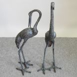 A pair of modern bronzed metal garden models of cranes,