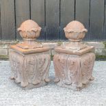 A pair of cast iron gatepost finials, with acanthus decoration,