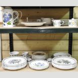 Two shelves of Portmeirion Botanic Garden pattern part tea and dinner service,
