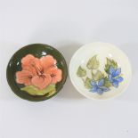A Moorcroft Hibiscus pattern pottery dish, together with another,