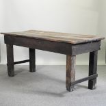 A mid 20th century wooden work bench,