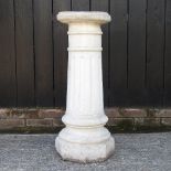 A reconstituted stone fluted column,