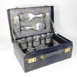 An early 20th century silver mounted glass vanity set, to include brushes and a hand mirror,