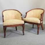 A pair of yellow upholstered tub shaped armchairs,