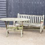 A teak slatted garden bench, 160cm, together with a folding garden table,