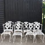A set of eight white painted metal garden chairs