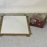 A stationery cabinet, together with a wall mirror,