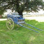 An early 20th century painted wooden horse drawn cart,