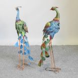 A painted metal model of a peacock, 85cm high,