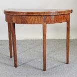 A George III mahogany and inlaid half round folding card table,
