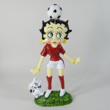 A modern painted metal Betty Boop doorstop,