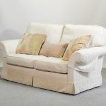 A Wesley Barrell cream herringbone upholstered two seater sofa,