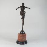 An Art Deco style bronze figure of a dancer, on a marble base,