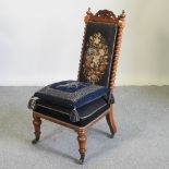 A Victorian rosewood chair, with a tapestry seat,