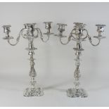A pair of silver plated four branch table candelabra,