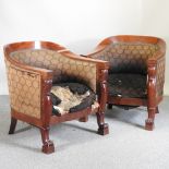 A pair of 19th century Empire style mahogany and blue and gold upholstered tub shaped armchairs,