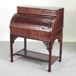 A 20th century Chinese hardwood cylinder top desk,
