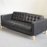 A modern Danish black leather upholstered sofa,