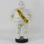 A painted metal model of the Michelin man,