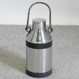 A stainless steel milk churn,