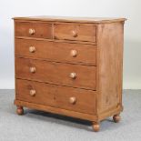 An antique pine chest of drawers,