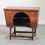 A 19th century elm dough bin converted to a child's desk,