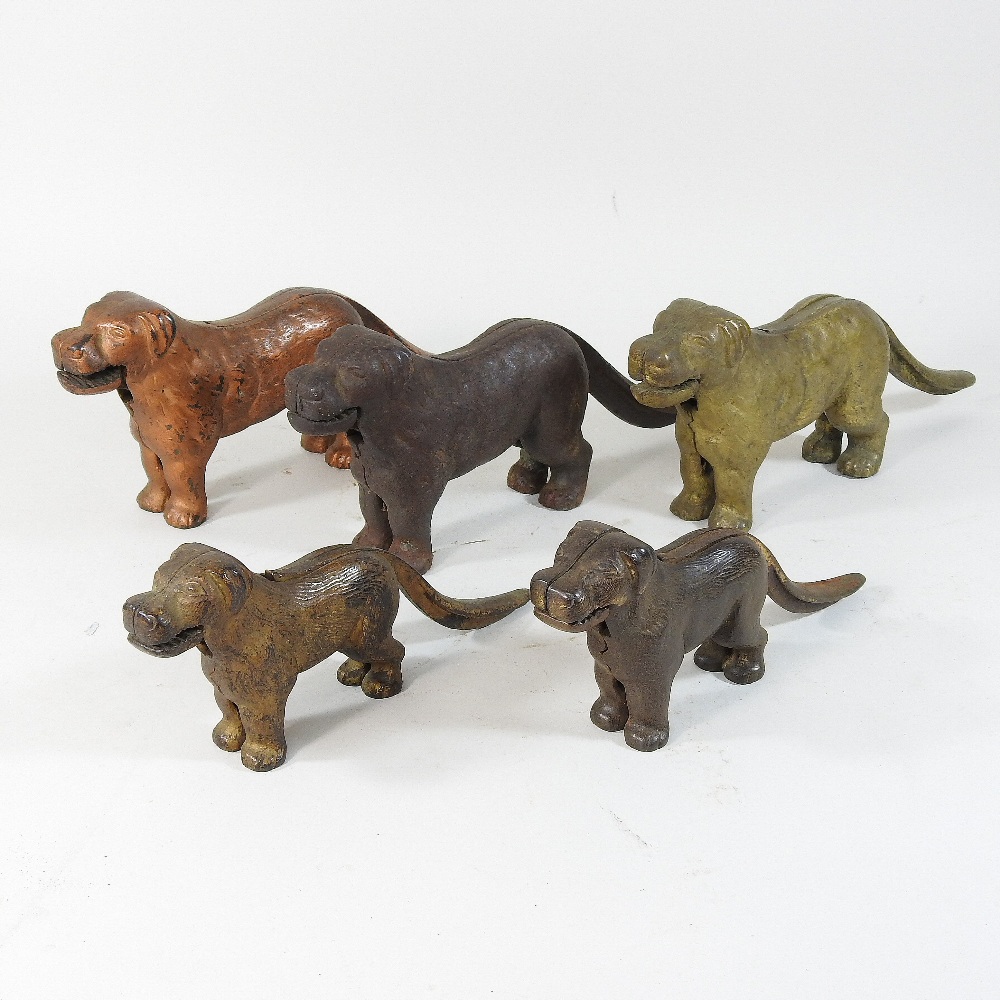 A collection of five 19th century cast iron novelty nut crackers, each in the form of a dog,