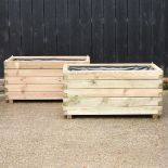 A pair of wooden slatted garden planters,