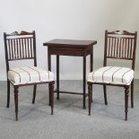 A pair of Edwardian mahogany side chairs, bearing a label for James Shoolbred and Co,