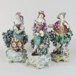 A pair of Derby porcelain bocage figures, circa 1770, of a musician and his companion, 26cm high,