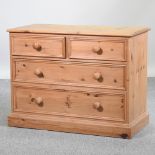 A modern pine chest of drawers,