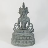 A 20th century bronze figure of a seated buddha,