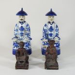 A pair of modern Chinese blue and white porcelain figures, 27cm high,