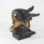 An Art Deco style bronzed head of a lady,