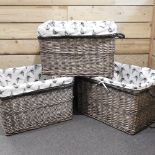 A set of three log baskets, with pheasant print liners,