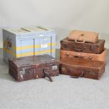 A collection of vintage leather suitcases and a wooden trunk