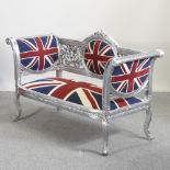 A modern silver painted sofa, upholstered with a union jack design,