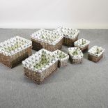 A collection of wicker baskets, each with a stag decorated liner,
