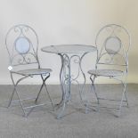 A grey painted metal patio set, comprising a table, 60cm diameter,