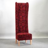 A modern red upholstered high back side chair,
