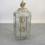 A modern large brass and glass hanging lantern,
